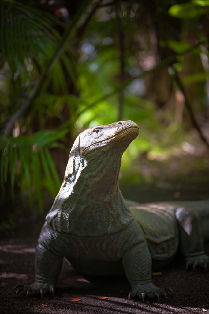 A Komodo dragon basking in the sunlight amidst a vibrant jungle environment.